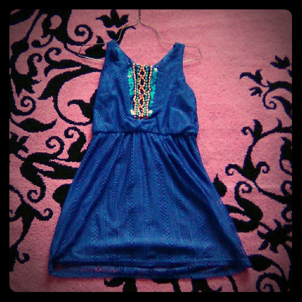 A beautiful blue patterned dress. That has never b